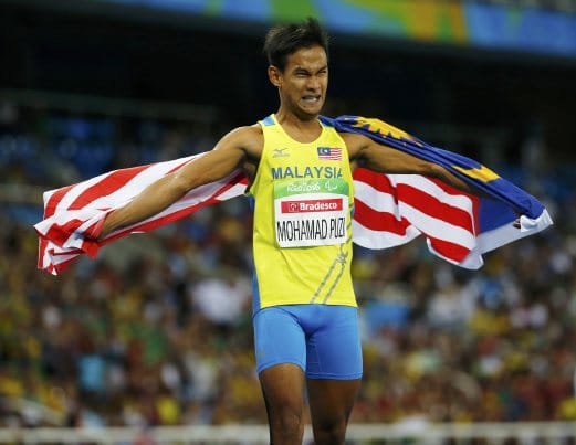 2016 Rio Paralympics - Men's 100m - T36 Final - Olympic Stadium - Rio de Janeiro, Brazil - 10/09/2016. Mohamad Ridzuan Mohamad Puzi of Malaysia celebrates after winning the gold medal in the event. REUTERS/Ricardo Moraes FOR EDITORIAL USE ONLY. NOT FOR SALE FOR MARKETING OR ADVERTISING CAMPAIGNS.