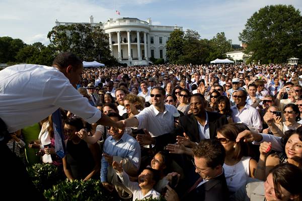 Jul. 21, 2010 - Washington, DC - President Barack Obama greets people at an all appointee event on the South Lawn of the White House, June 29, 2010. (Barack Hussein Obama II (born August 4, 1961) is the 44th President of the United States. He is the first African American to be elected to office and the first president born outside the contiguous United States. Born in Honolulu, Hawaii, Obama is a graduate of Columbia University and Harvard Law School. He worked as a civil rights attorney and taught constitutional law at the University of Chicago Law School from 1992 to 2004. While serving three terms representing the 13th District in the Illinois Senate from 1997 to 2004, he ran unsuccessfully in the Democratic primary for the United States House of Representatives in 2000.