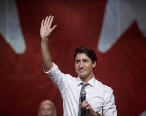 Justin Trudeau, Canada's prime minister, waves during the end of a town hall event in Bellevile, Ontario, Canada, on Thursday, Jan. 12, 2017. Trudeau confirmed that his senior advisers have met with U.S. President-elect Donald Trump's officials. Photographer: Cole Burston/Bloomberg via Getty Images