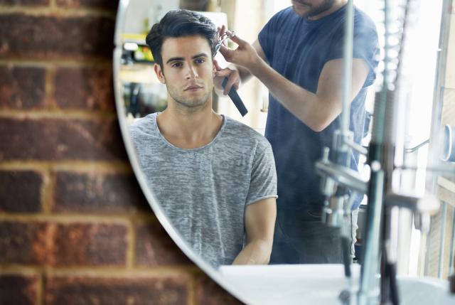 man getting hair cut